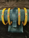 Gold polish 4 pic Bangles Size 2.4 with green red stone