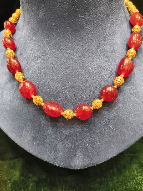 Red and golden beads mala