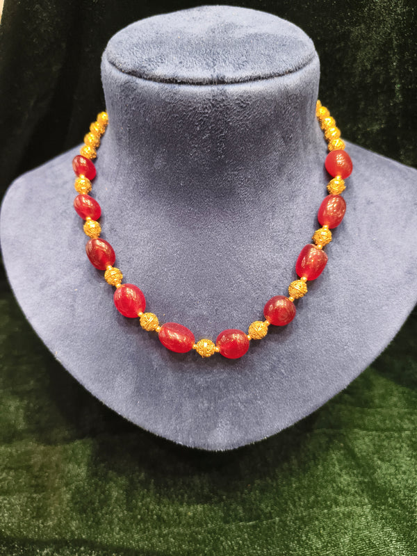 Red and golden beads mala